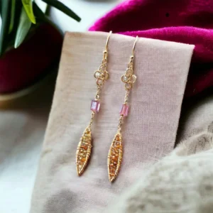 Earrings measuring 2 1/4 inches long, adorned with Australian opal, pink tourmaline chicklets, and multi-colored tourmaline feathers.
